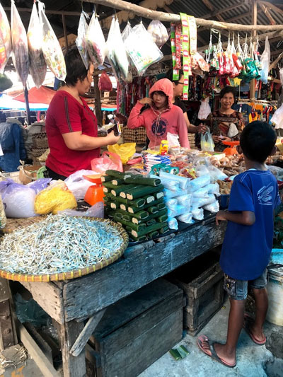 Locally made tofu and tempe for sale in the market.